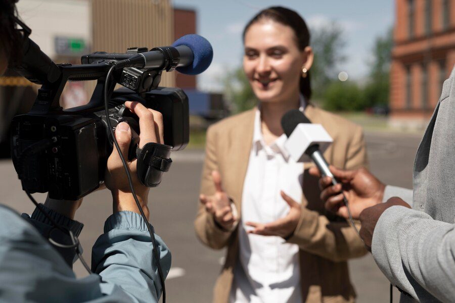 journalist-taking-interview-from-woman_23-2149029319
