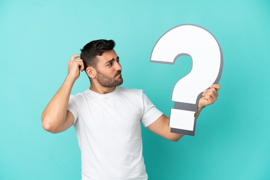 young-handsome-caucasian-man-isolated-blue-background-holding-question-mark-icon-having-doubts_1368-250211
